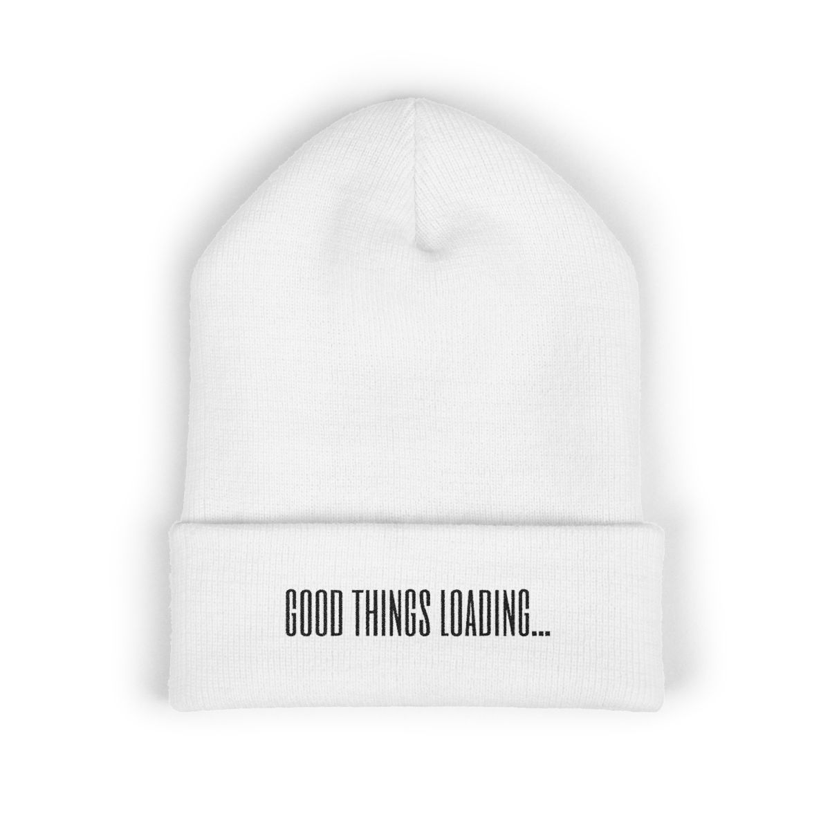 White cuffed beanie with “Good Things Loading…” embroidered across the fold.